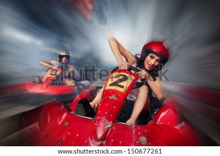 girl is driving Go-kart with speed in Karting