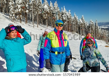 Portrait of group of skiers standing on ski slope