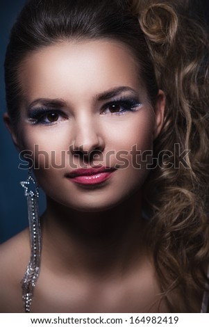 Portrait of a glamorous girl with evening make up and long lashes