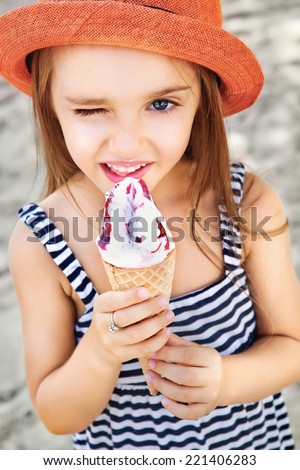 Cute Toddler Girl Eating Ice-Cream