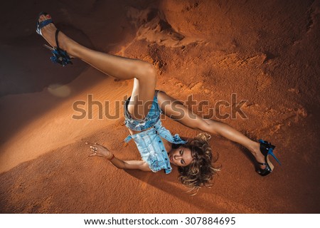 Young attractive woman is falling  head over heels