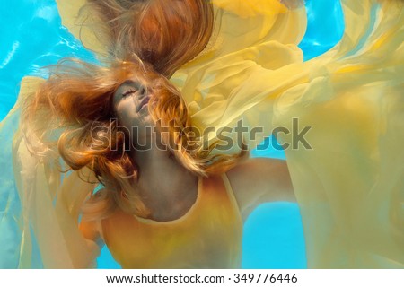 Underwater shoot of a relaxed  flying  woman