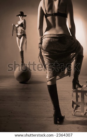 Woman watching herself balancing on the sphere