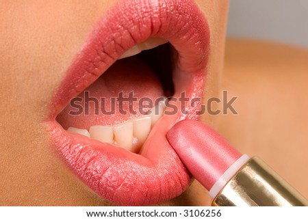 making up  face with lipstick