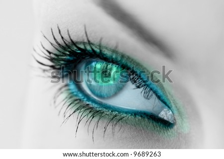 beautiful woman\'s open green eye