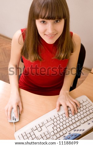 Nice caucasian girl working with computer at office