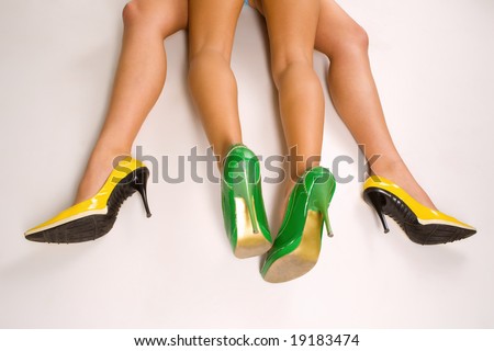 Four beautiful women legs in high heels pretending to making love