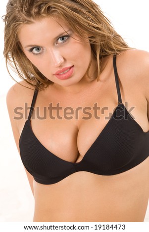 stock photo Pretty young blond woman with big breasts in black bikini