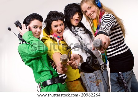 stock photo : Group of teenager girls with headphones and microphones
