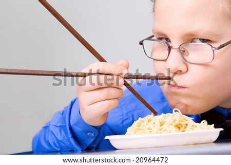 fat boy eating food. stock photo : Hungry fat boy