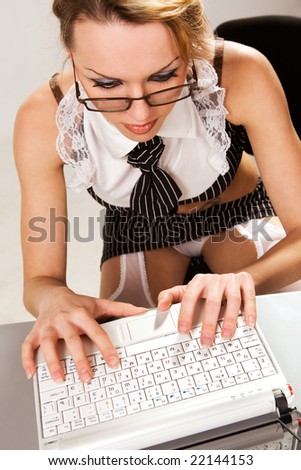 stock photo Sexy girl wearing very short skirt pretending to work on 