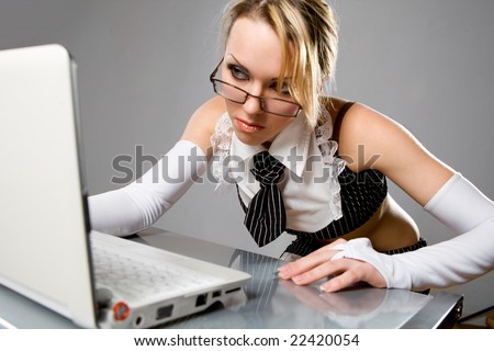 stock photo Sexy girl wearing very short skirt pretending to work on 