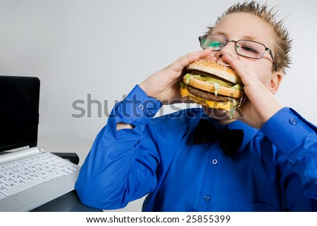 fat person eating burger. stock photo : Young fat school