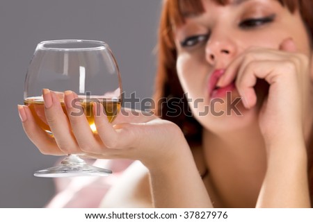 Picture of dreamy relaxing woman with wine glass