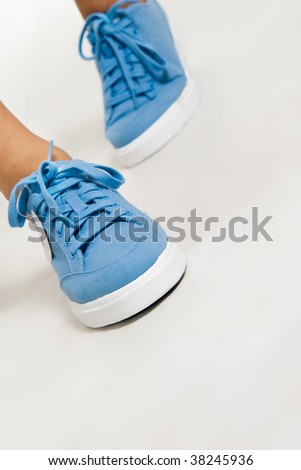 Trendy sport footwear on woman legs
