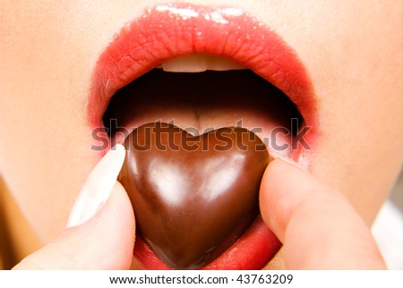 Поезија Stock-photo-woman-eating-heart-shaped-chocolate-candy-43763209