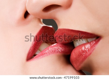 Beautiful female lovers kissing closeup