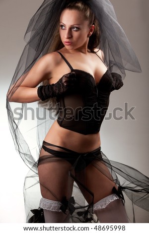 stock photo Sexy bride in veil and black lingerie