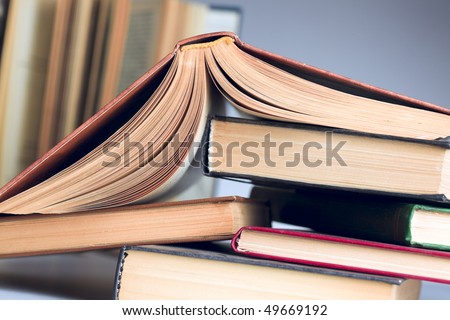 Turned down open book on few books in stock