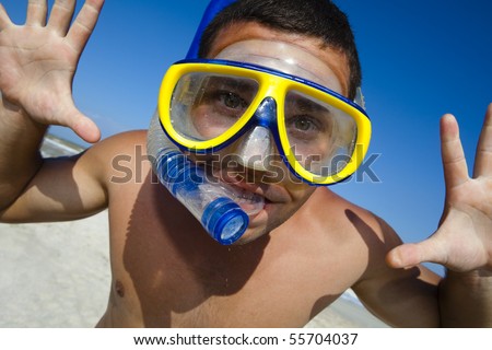 Happy diving man in a swimming mask and snorkel. Funny picture.