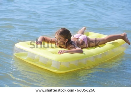Young Brown Haired Child on Air Bed