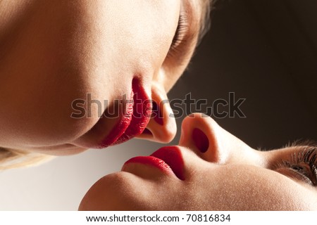 Closeup of pair girl mouths are going to kiss