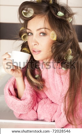 stock photo Shot of sexy housewife in pink dressing gown drinking coffee