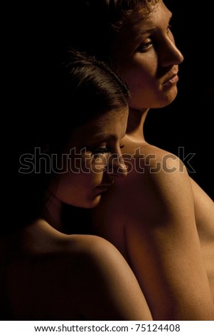 Profile of young Couple Dramatic image shot in studio, on dark