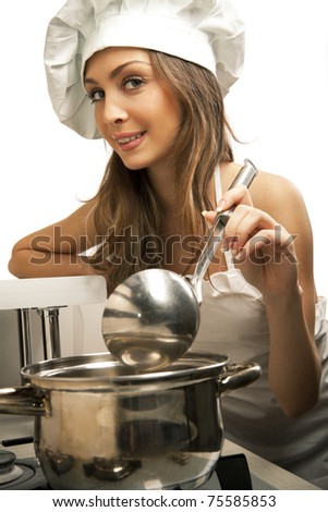 stock photo Portrait of sexy housewife tasting dish in kitchen room