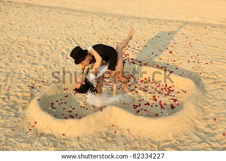 stock photo Beach wedding of happy newlywed couple