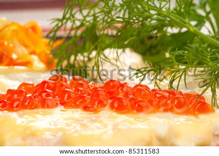 Broiled salmon steak with cream souse and red caviar  decorated with dill