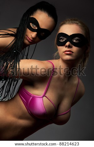 Portrait of young women with fancy mask