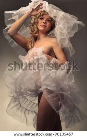  Portrait of young beautiful sexy woman in white tutu and bridal veil