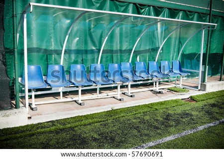 Coach and reserve benches in a soccer field