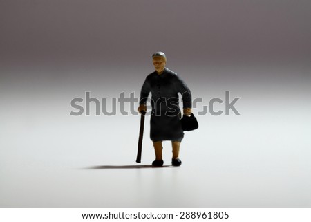 Miniature senior lady walking stick
