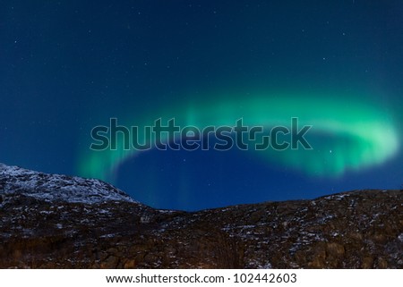 Aurora Borealis in Norway curling and rippling
