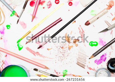 Various artists mess with paints and craft materials