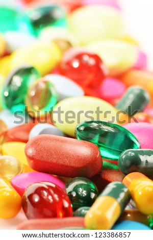 Composition with dietary supplement capsules and drug pills