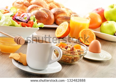 Breakfast including coffee, bread, honey, orange juice, muesli and fruits