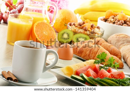 Breakfast With Coffee, Orange Juice, Croissant, Egg, Vegetables And Fruits