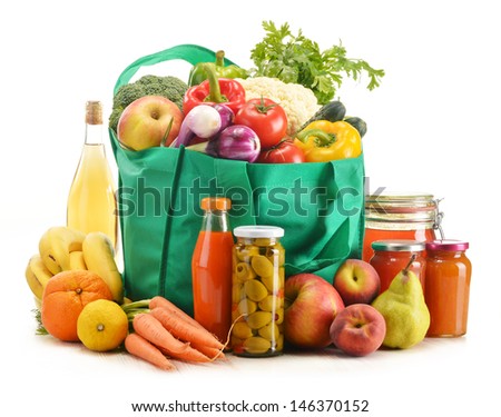 Green Shopping Bag With Grocery Products On White Background