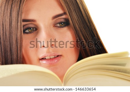 Young woman reading a book. Female student learning