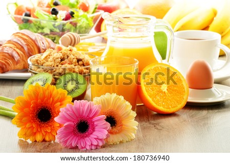Breakfast with coffee, juice, croissant, salad, muesli and egg. Swedish buffet