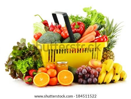 Plastic shopping basket with groceries isolated on white background