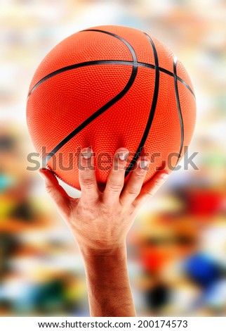 Hands catching basketball