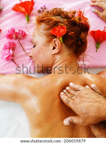 Beautiful young woman getting professional spa massage