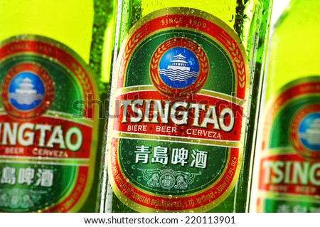 POZNAN, POLAND - AUGUST 20, 2014: Tsingtao beer, product of Tsingtao Brewery, China\'s second largest brewery located in Qingdao in Shandong province