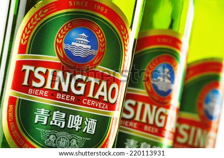 POZNAN, POLAND - AUGUST 20, 2014: Tsingtao beer, product of Tsingtao Brewery, China's second largest brewery located in Qingdao in Shandong province