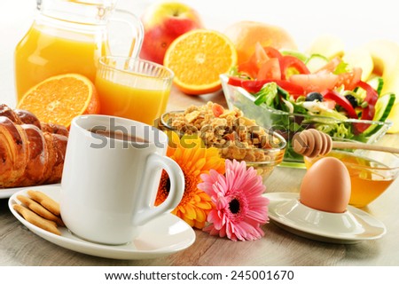 Breakfast with coffee, juice, croissant, salad, muesli and egg. Swedish buffet