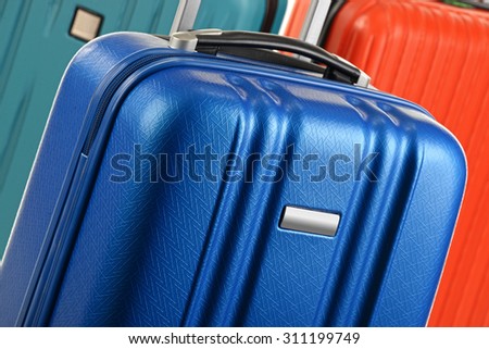 Plastic travel suitcases. Hand luggage.